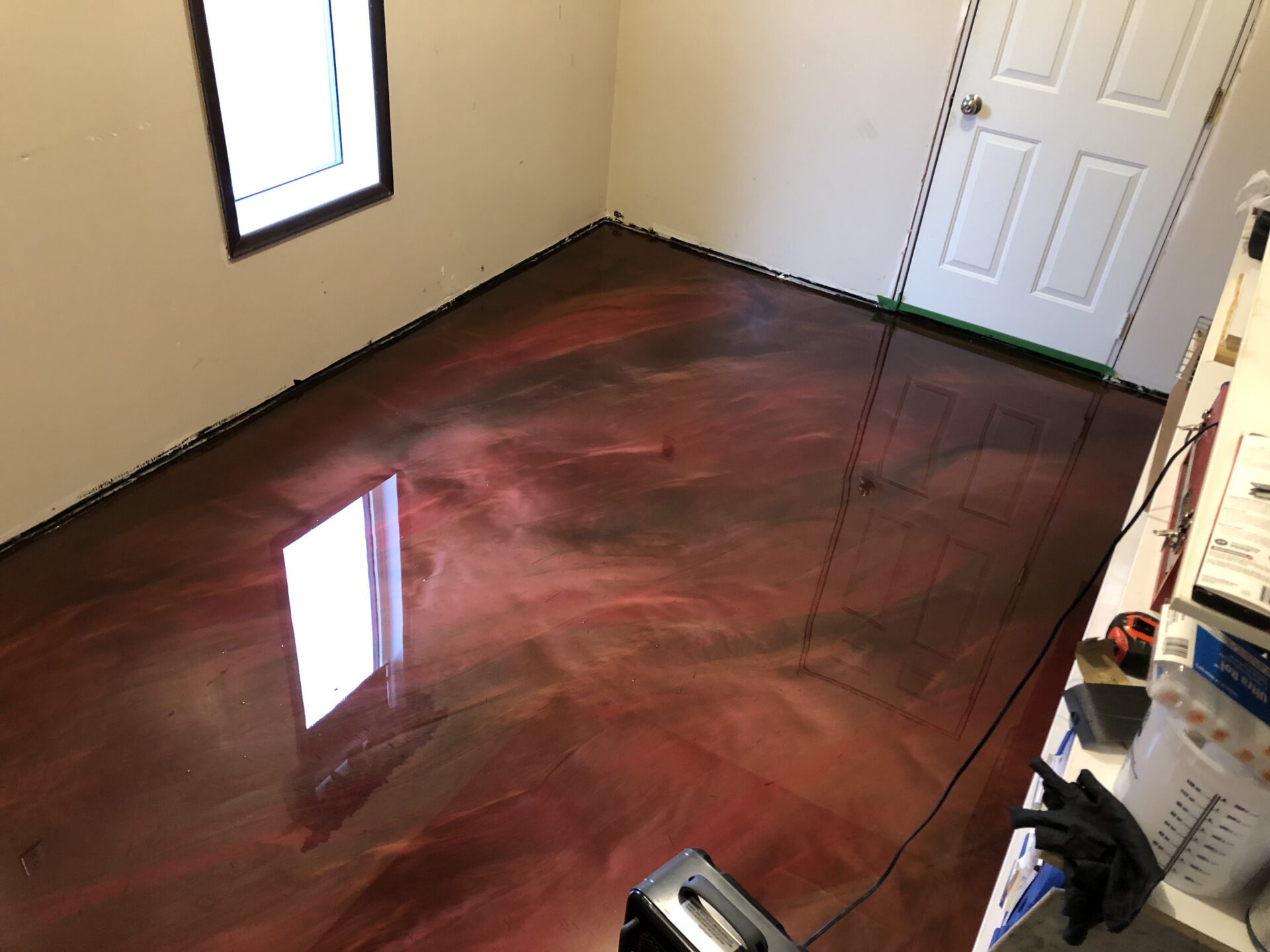 Metallic maroon swirl epoxy flooring in new bedroom